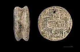 Disque auriculaire de l'âge du bronze MHNT.