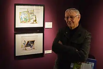 Milo Manara, près des dessins de Fellini le représentant.