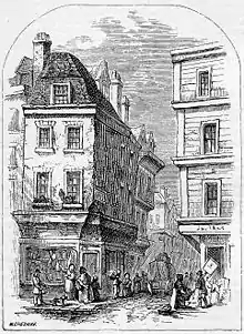 Lithographie représentant une rue assez étroite, immeubles, quelques passants
