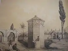 La Tour des Vents avec son cadran méridional au centre.