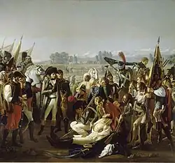 Peinture à l'huile montrant Napoléon au premier plan observant le corps de Desaix. Desaix est vêtu d'une chemise blanche et son torse est mis à nu afin de montrer la blessure. Un grand nombre de curieux assistent également à la scène.