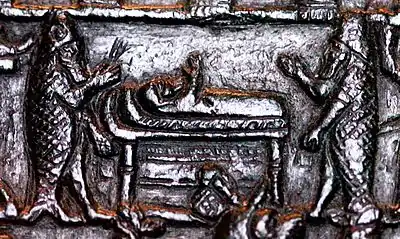 Scène de rituel de guérison d'un malade, détail de la « plaque de Lamashtu », VIIIe&nbsp;siècle&nbsp;av. J.-C. Musée du Louvre.