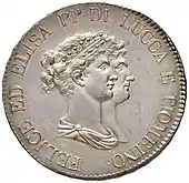 Face d'une pièce de monnaie ayant comme dessin deux visages