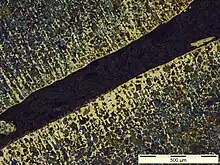 Métallographie d'une décarburation de surface d'un acier.