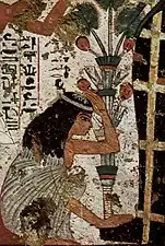 Veuve en deuil devant la momie de son époux.