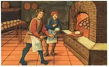 Un boulanger avec son mitron ; les miches rondes de l'illustration étaient les plus courantes.