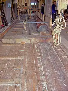 Chariot porte-grume, avec la fenêtre de délignage. Moulin Het Jonge Schaap