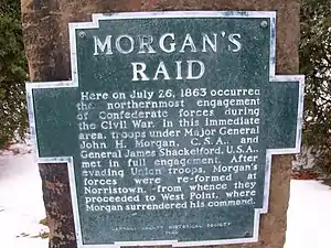 aluminum plaque bolted to sandstone. Plaque is shape of outline of Carroll County, Ohio, with raised letters that read : MORGAN'S RAID Here on July 26, 1863 occurred the northernmost engagement of Confederate forces during the Civil War. In this immediate area, troops under Major General John H. Morgan, C.S.A., and General James Shackleford, U.S.A., met in full engagement. After evading Union troops, Morgan's forces were re-formed at Norristown, from whence they proceeded to West Point, where Morgan surrendered his command. CARROLL COUNTY HISTORICAL SOCIETY 1969
