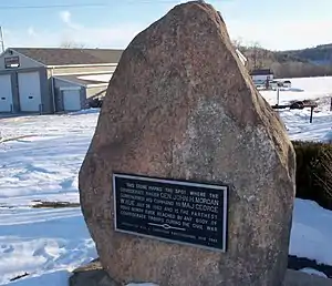Granite stone standing in snow covered lawn. aluminum plaque on face of stone, raised letters read "This stone marks the spot where the confederate raider John H. Morgan surrendered his command to Maj. George W. Rue July 26, 1863 and is the farthest point north ever reached by any body of Confederate troops during the Civil War. Erected by Will W. Thompson East Liverpool, Ohio1909"