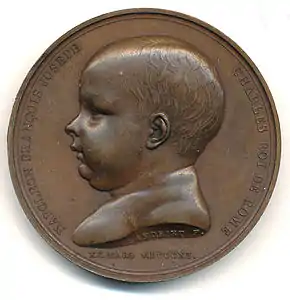 Revers de cette médaille à l'effigie de l'enfant.