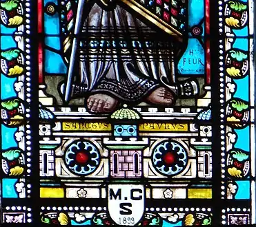 Signature d'Henri Feur sur le vitrail représentant saint Paul.