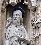 Plan rapproché de saint Matthieu accompagné d'un ange.