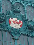 Blason de la gare d'Austerlitz, sur la verrière d'entrée nord de la ligne 5 du métro.