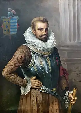 Peinture d'un homme barbu habillé à la mode du XVIe&nbsp;siècle avec une large fraise et un plastron décoré, sa main droite repose sur sa hanche et sa main gauche tient une cane.