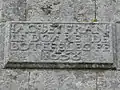Inscription lapidaire au mur de l'église (1638).