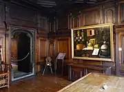 Ancienne salle de réunion des administrateurs de l’Œuvre Notre-Dame. Au premier plan, table à calculer du receveur de l’Œuvre. Boiseries de 1582. Tableau de Sébastien Stoskopff : Grande Vanité (1641)