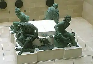 Les quatre esclaves en bronze, sauvés de la fonte en 1790, sont les seuls restes de la statue de Desjardins, aujourd'hui au Musée du Louvre.