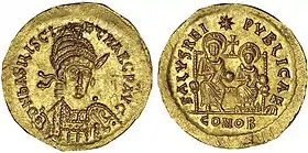 Photographie des deux faces d'une pièce en or.