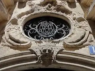 Oculus fermé par une grille à monogramme (détail du no&nbsp;16).