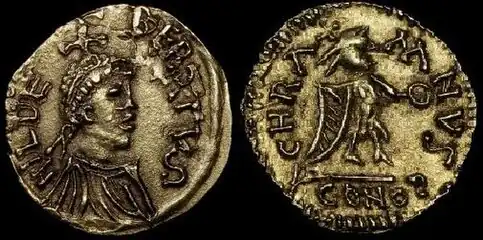 Tiers de sou d'or de Childebert Ier.Avers : Buste diadémé à droite, une croisette sur la tête.Revers : Victoire debout à droite tenant une couronne. Bibliothèque nationale de France.