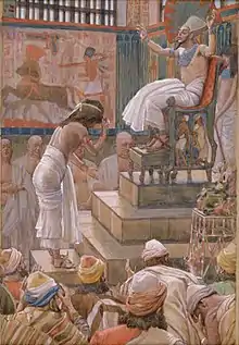 Peinture d’un pharaon sur un trône, salué par un homme torse nu.