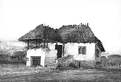 Aquarelle de Toma T. Socolescu - Ancienne maison de Ploiești (Județul Prahova, Roumanie) tel qu'il en existait jusqu'au début du XXe&nbsp;siècle.