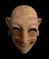 Masque grimaçant, H 0,15&nbsp;m, terre cuite (Ve – IVe&nbsp;siècle av. J.-C.).
