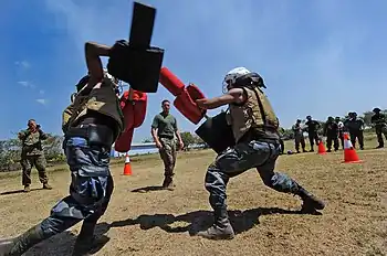 US Navy 110324-N-WX845-656 U.S. Marine Sgt. Michael Roth, assigned to Marine Corps Training and Advisory Group, observes Nicaraguan sailors and sol
