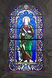 Vitrail de l'église Notre-Dame de Veyries (Labastide-Castel-Amouroux). Offert par la famille Canelle de Lalobbe (blason en pied), fabriqué par la manufacture de vitraux Gesta (cartouche en tête). Saint non identifié.