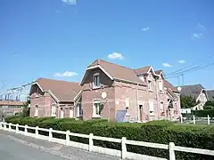 Habitations groupées par deux.