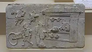 brique murale funéraire de la période Han, une brouette est représentée