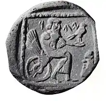 Drachme judéenne de la période perse frappée en Samarie et trouvée à Gaza (Ve siècle av. J.-C.). Divinité Yahu assise sur une roue ailée et tenant un faucon. Inscription YDH : Yehud (« Judée »).