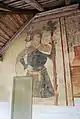 Peinture murale en façade ouest : saint Christophe (XVe siècle).